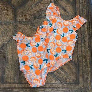 Cat and Jack sister swim suits with oranges